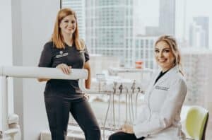 Board-certified orthodontist Dr. Emilia Taneva with orthodontic team in Downtown Chicago office
